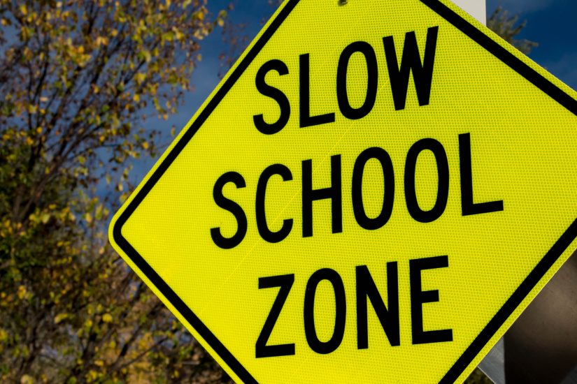 Slow school zone sign. 